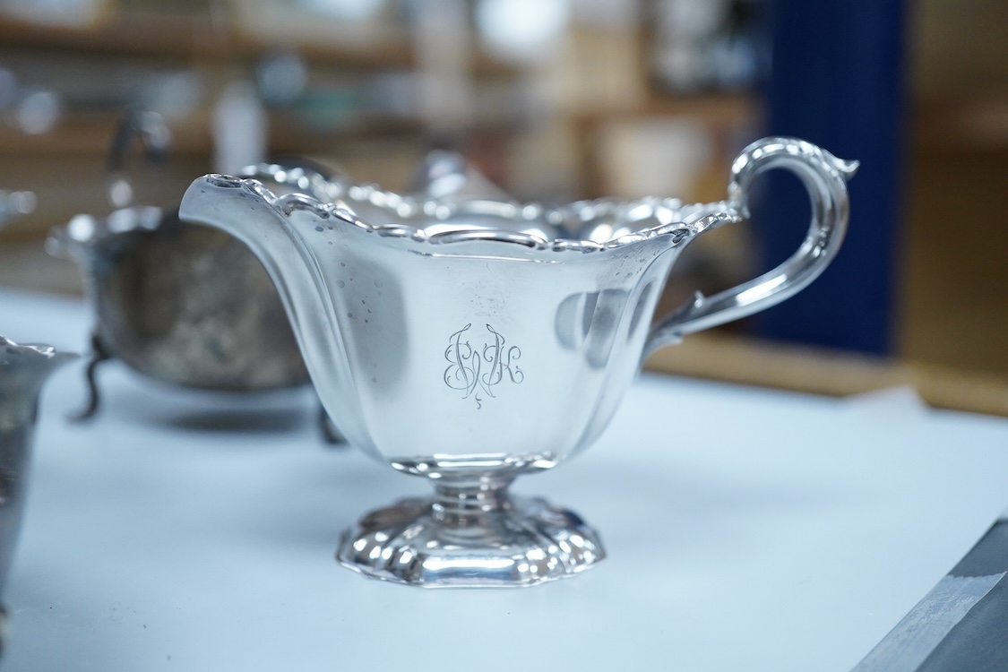 A collection of small silver wares to include a George V silver porringer, two George V silver sauce boats, a let Victorian silver sugar bowl, a George III silver goblet, with later embossed decoration, a George V small